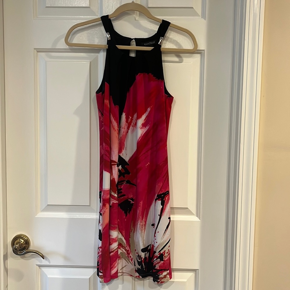 Dress it up or down.  Super cute sleeveless dress.